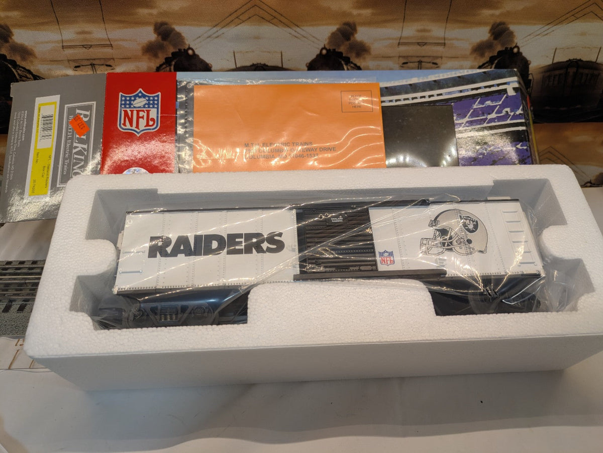 MTH Rail King 30-74265 Oakland Raiders boxcar in foam insert and plastic wrap with NFL-branded box visible