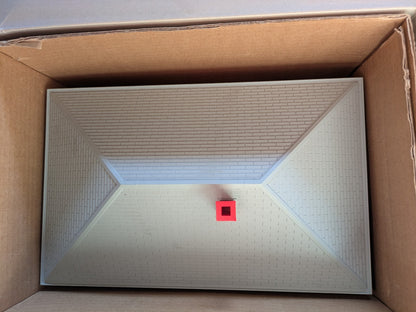 Lionel 6-14257 #133 Passenger Station top view showing the gray roof and red chimney inside the box