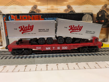 Broadside view of Lionel 6-16330 Katy flatcar carrying two silver trailers