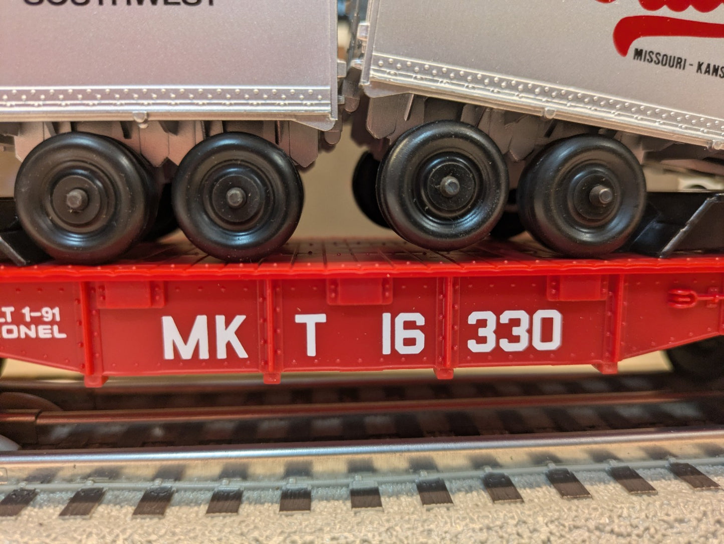 Close-up of MKT 16330 reporting marks on Lionel 6-16330 flatcar