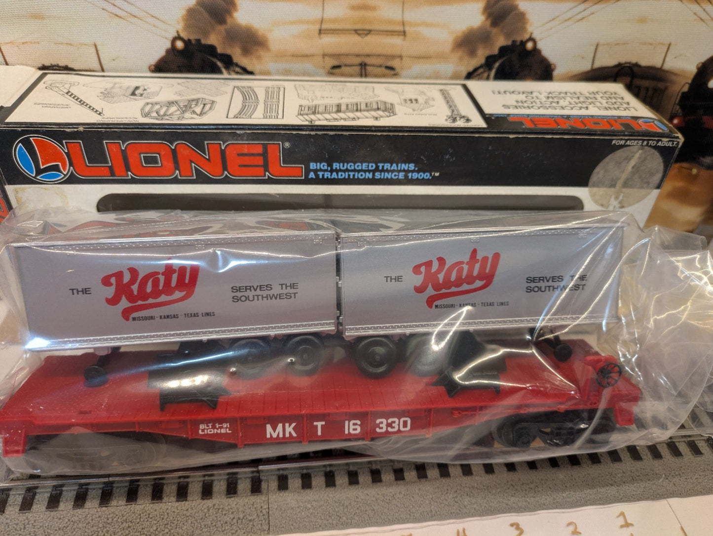 Lionel 6-16330 Katy flatcar with trailers in original plastic packaging