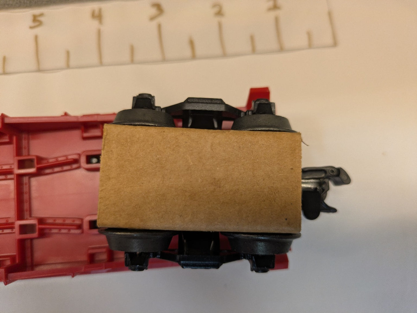 Opposite underside truck and operating coupler on Lionel 6-16330 flatcar
