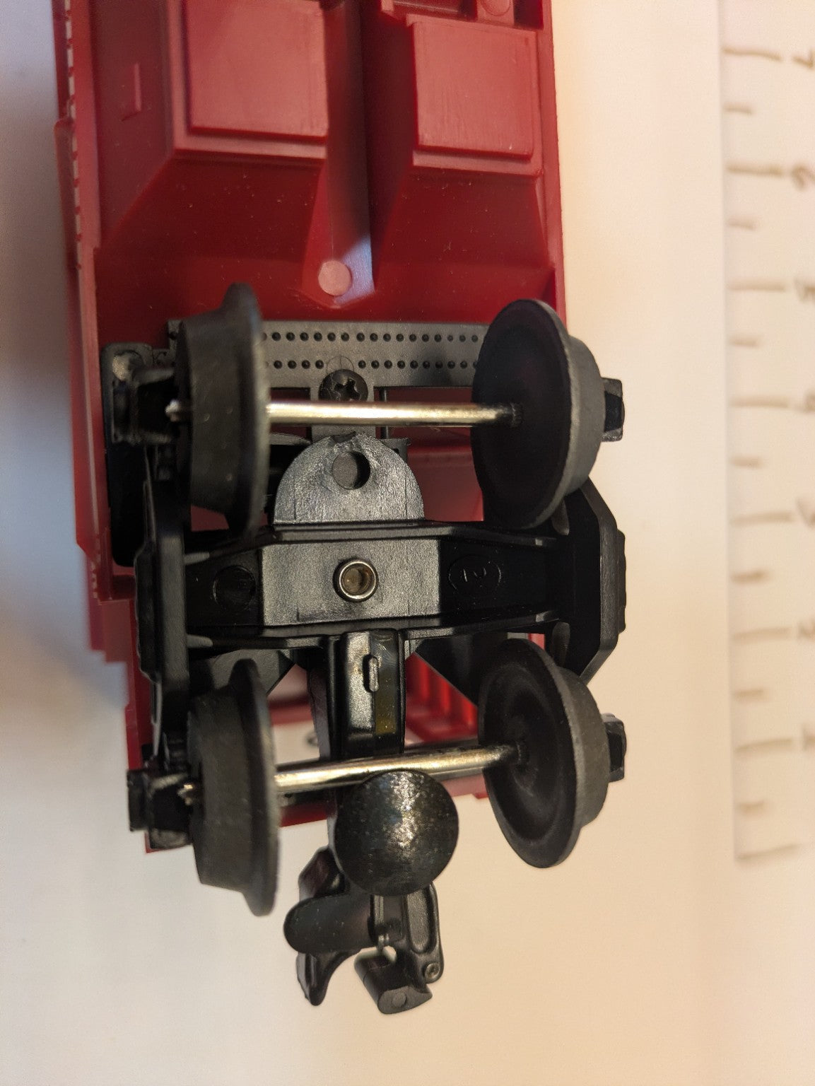 Truck, metal wheels and operating coupler detail on Lionel covered hopper 6-16412