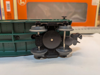 Lionel 6-16795 underside mechanical close-up showing black animation drive gear and metal wheels