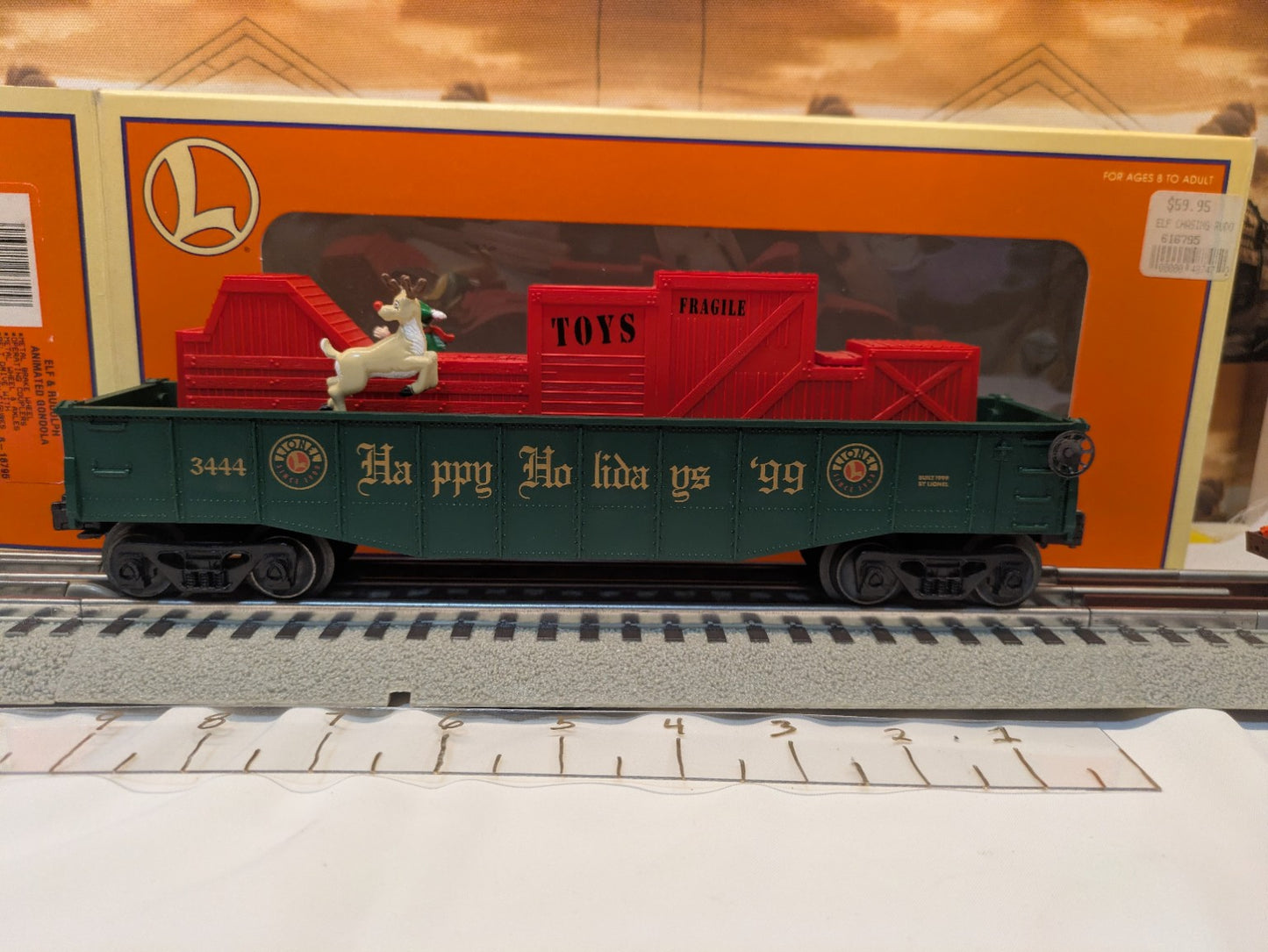 Lionel 6-16795 green Elf and Rudolph animated gondola broadside with red toy-load mechanism and original box