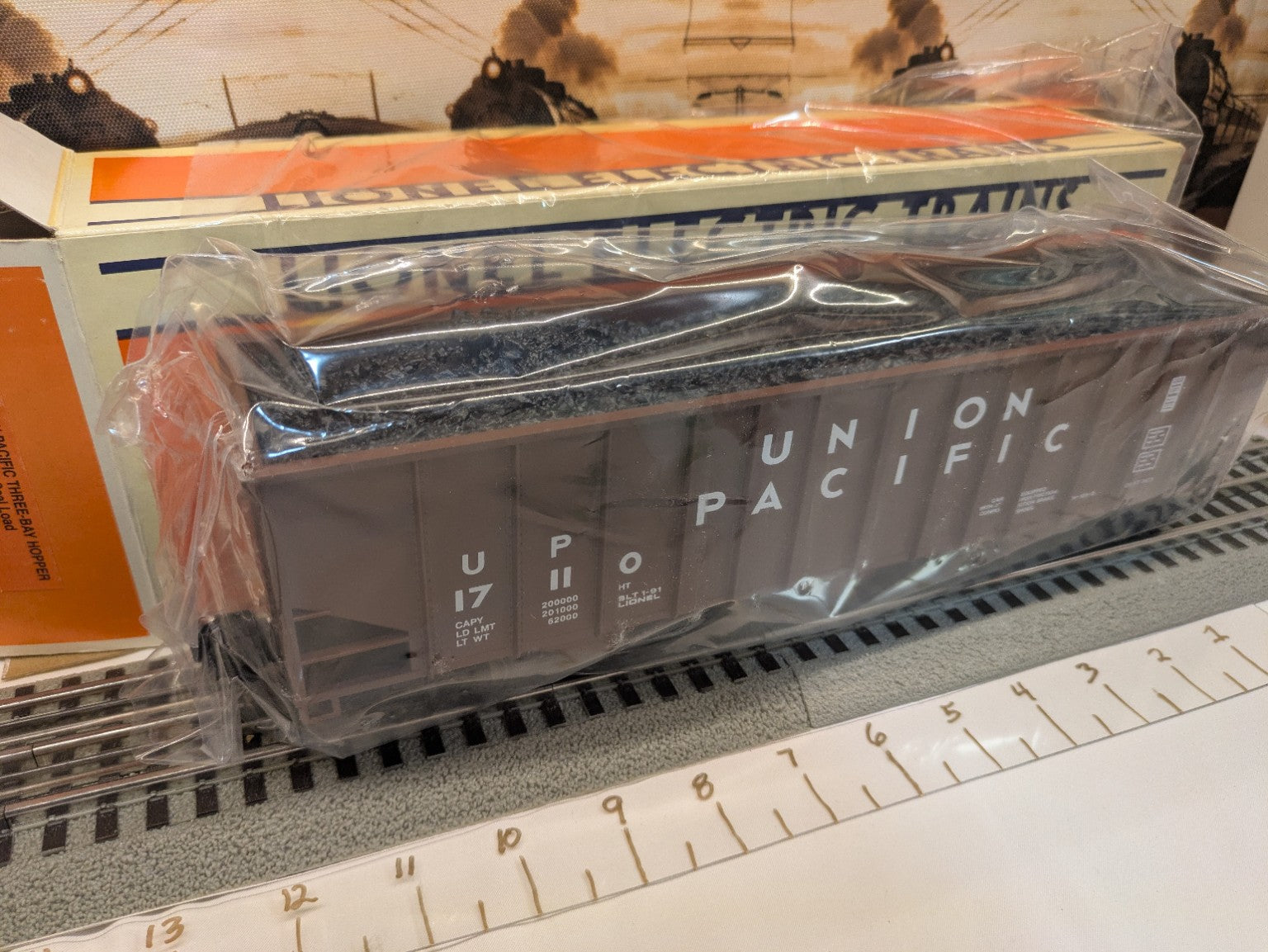Lionel 6-17110 Union Pacific three-bay hopper car in protective bag angled view