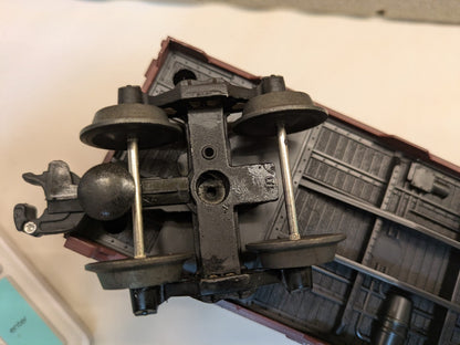 Lionel 6-17224 brown box car underside close-up showing truck and coupler
