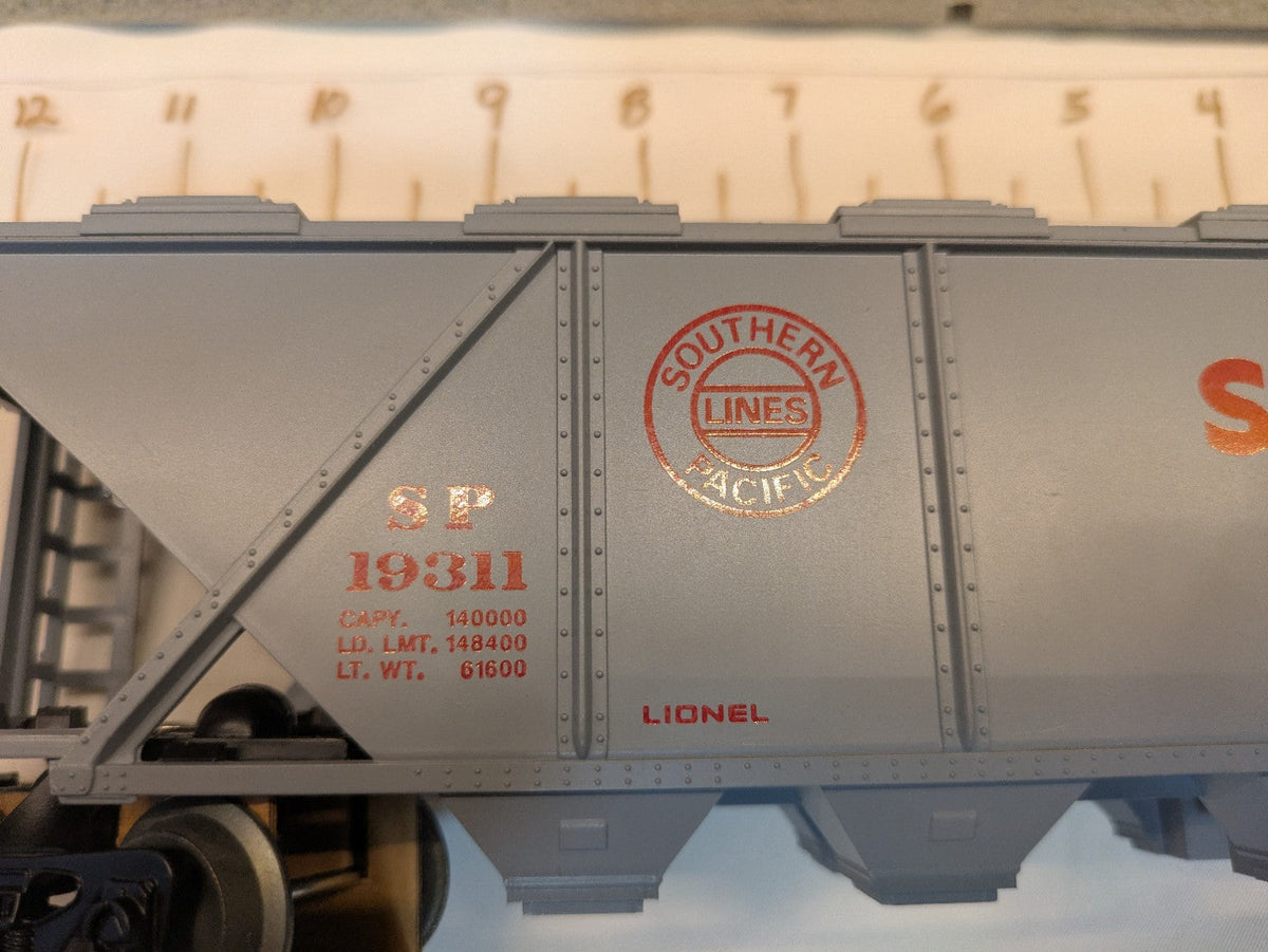 Lionel 6-19311 Southern Pacific gray covered hopper close-up showing red SP 19311 reporting marks and Southern Pacific Lines emblem