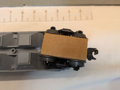Lionel 6-19311 Southern Pacific covered hopper underside close-up showing truck and coupler at one end