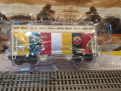 Lionel 6-19366 white, red, green, and gold Santa’s Little Hopper visible through clear inner packaging