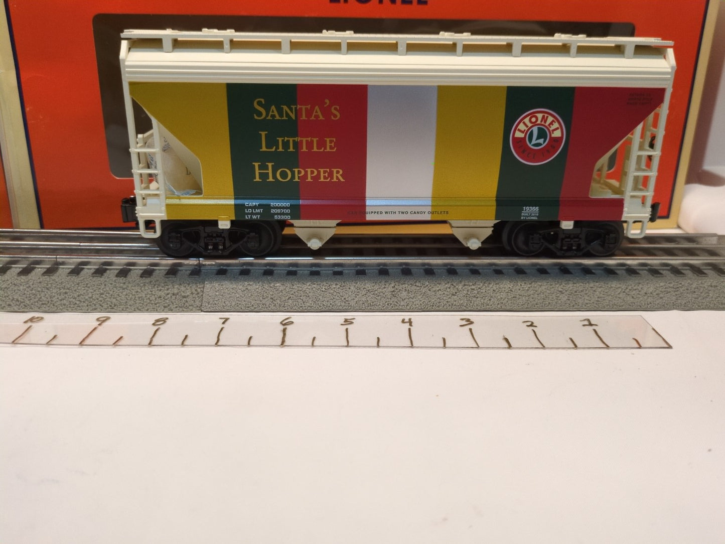 Lionel 6-19366 Santa’s Little Hopper broadside view in white, red, green, and gold showing road number 19366
