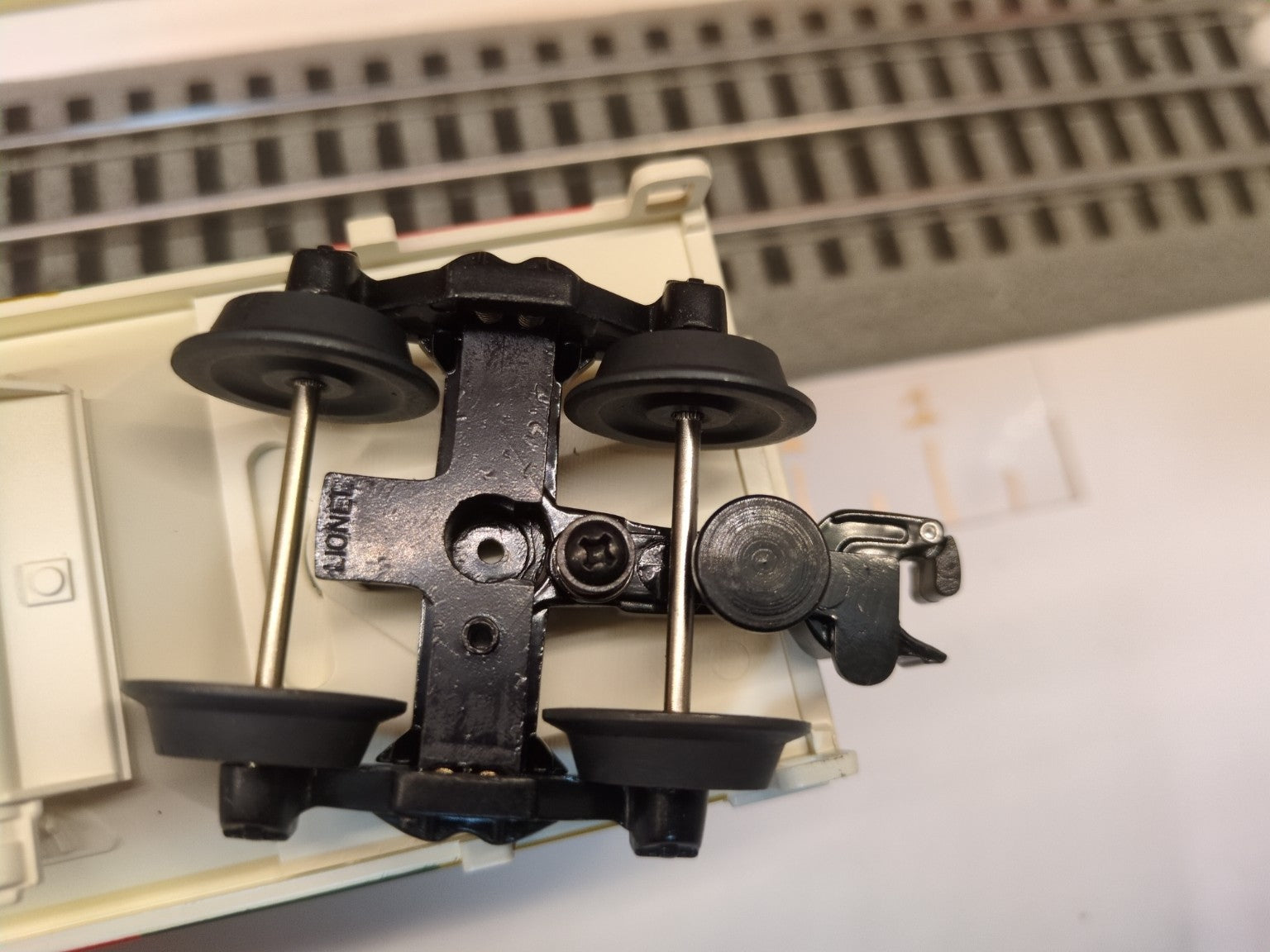 Lionel 6-19366 hopper underside close-up showing the opposite black die-cast truck and coupler