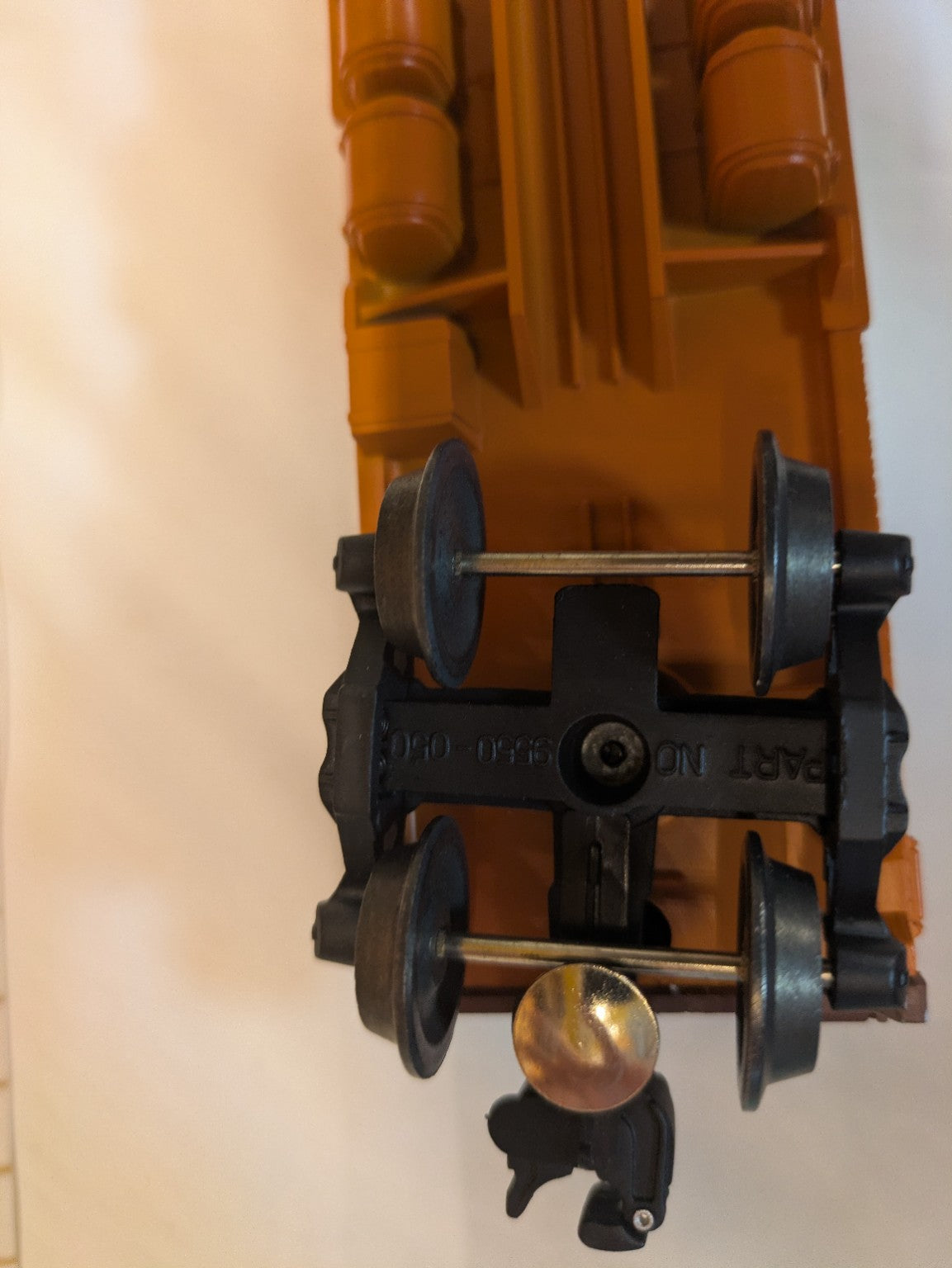 Lionel 6-19656 Milwaukee Road bunk car underside close-up of truck and coupler