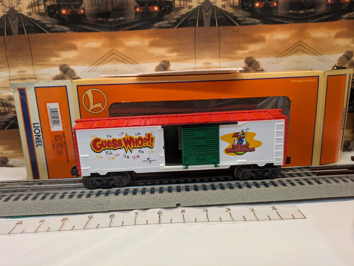Lionel 6-26244 Woody Woodpecker Boxcar in red, white, and green, broadside view with Lionel box