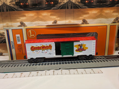 Lionel 6-26244 Woody Woodpecker Boxcar in red, white, and green, broadside view with Lionel box