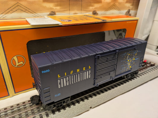 Lionel 6-26717 dark blue Constellation boxcar three-quarter view with Lionel box behind