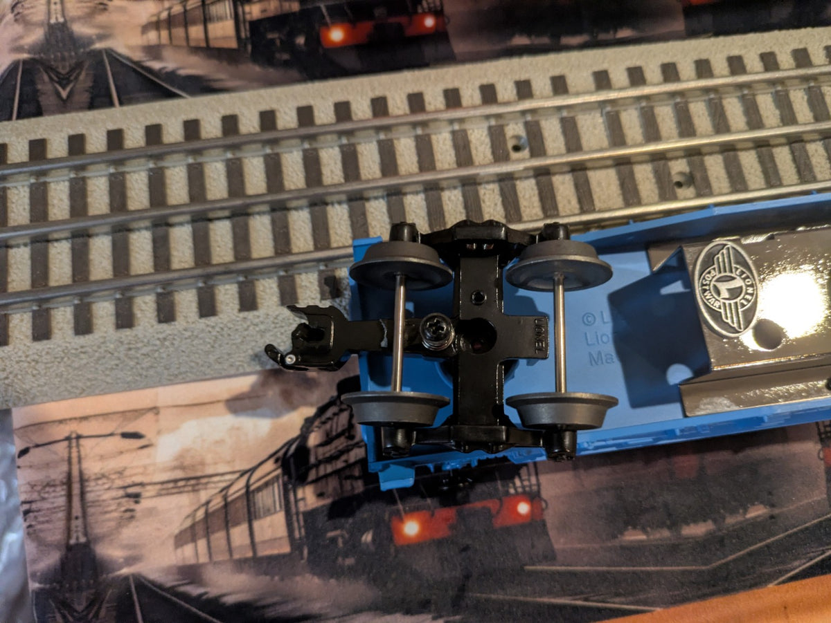 Second underside view of Lionel 6-29827 showing die-cast sprung truck and coupler