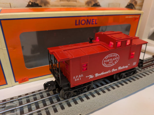 Lionel 6-36573 red SP&S caboose three-quarter view on track with Lionel box