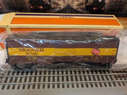 Lionel 6-52126 Milwaukee Road boxcar full side view in protective cellophane with original box, brown and yellow