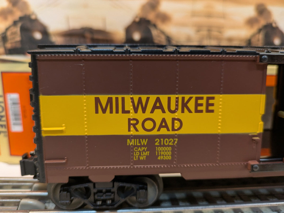 Lionel 6-52126 Milwaukee Road boxcar side detail showing MILW 21027 road number, brown and yellow
