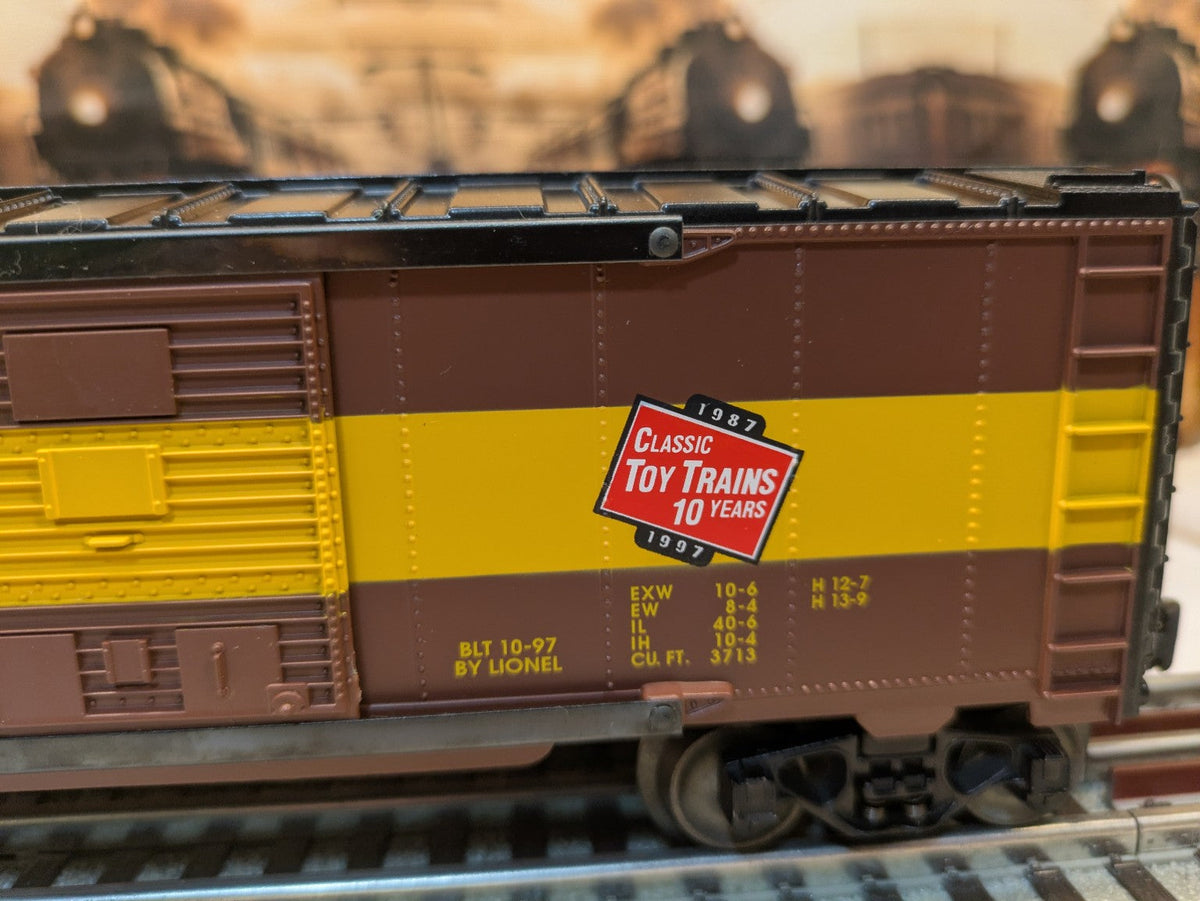 Lionel 6-52126 Milwaukee Road boxcar side detail with Classic Toy Trains 10th Anniversary emblem, brown and yellow