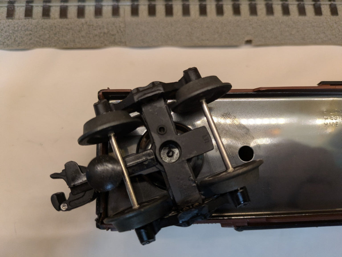 Lionel 6-52126 Milwaukee Road boxcar underside truck and coupler detail at one end