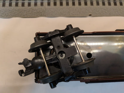 Lionel 6-52126 Milwaukee Road boxcar underside truck and coupler detail at one end