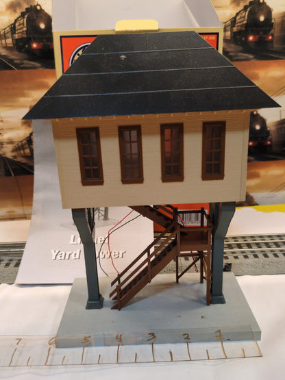 Lionel 6-83147 Yard Tower front view showing tan upper structure, black roof, brown windows and staircase