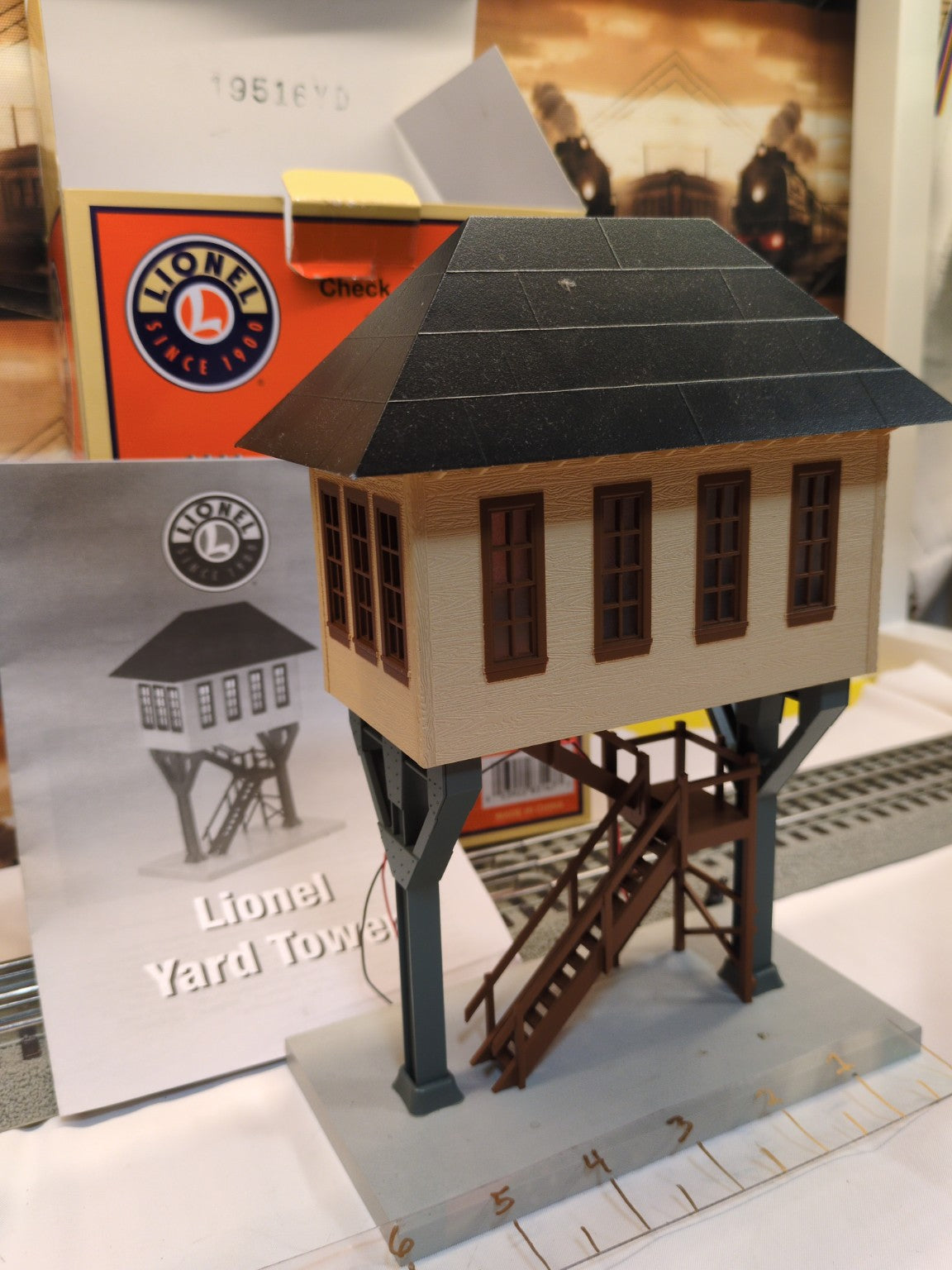 Lionel 6-83147 Yard Tower three-quarter view with tan tower, black roof, brown stairs, original box and instruction manual visible