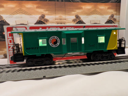 Lionel 6-9177 Northern Pacific bay-window caboose, broadside view showing NP 9177 on green and yellow body