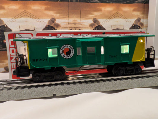 Lionel 6-9177 Northern Pacific bay-window caboose, broadside view showing NP 9177 on green and yellow body