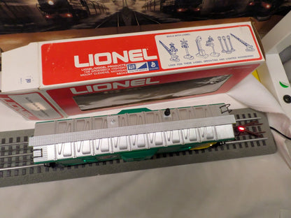 Lionel 6-9177 Northern Pacific bay-window caboose, elevated roof and side view with silver roof and green body