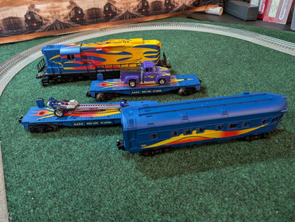 Lionel Custom Hot Rod Set with locomotive, hot rod flatcars, and passenger car