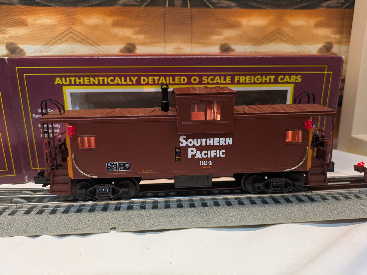 MTH Southern Pacific caboose 324 side profile with illuminated windows steps and operating couplers