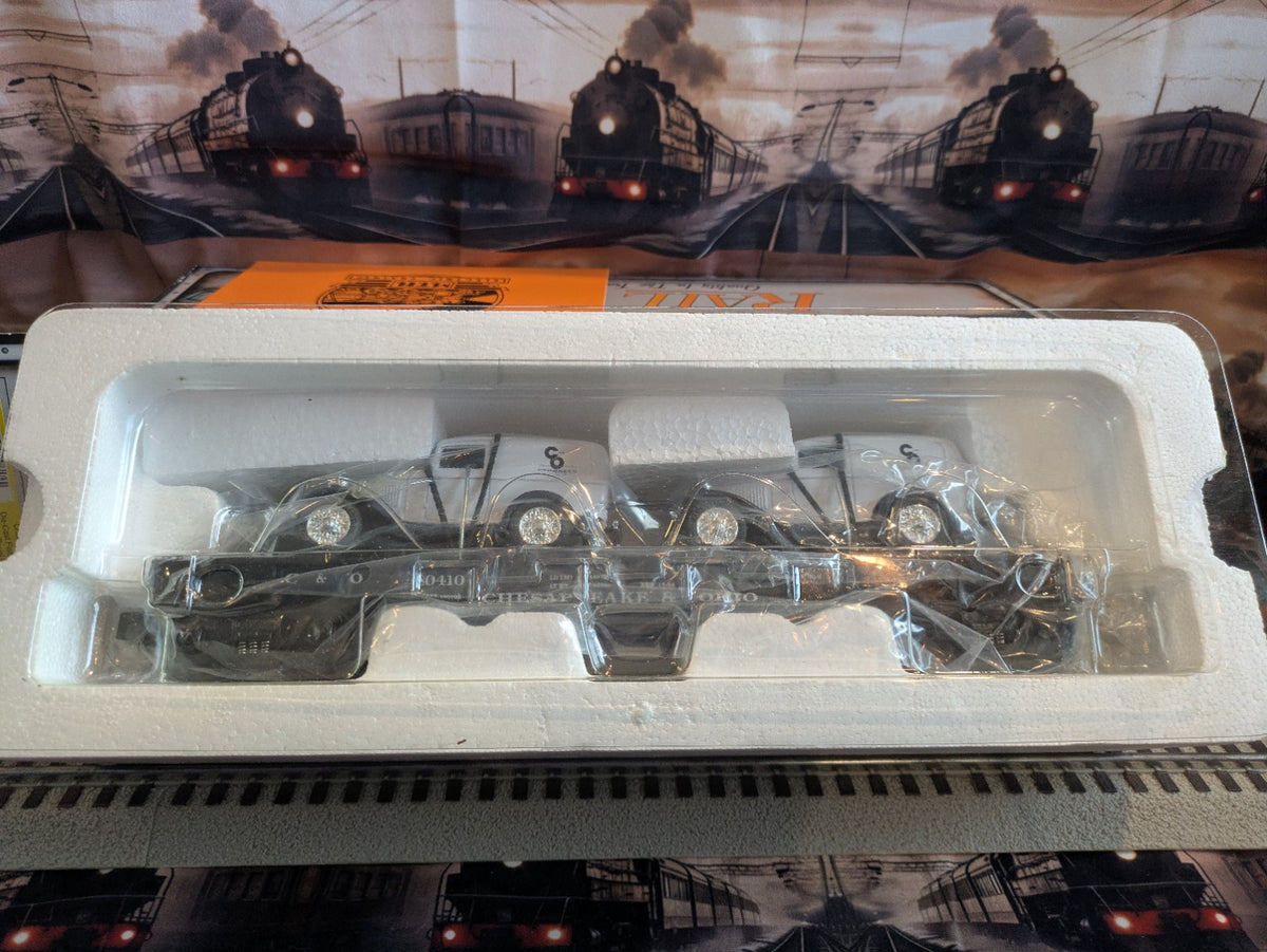 MTH 30-8304 Chesapeake & Ohio black flatcar with white panel vans in foam packaging