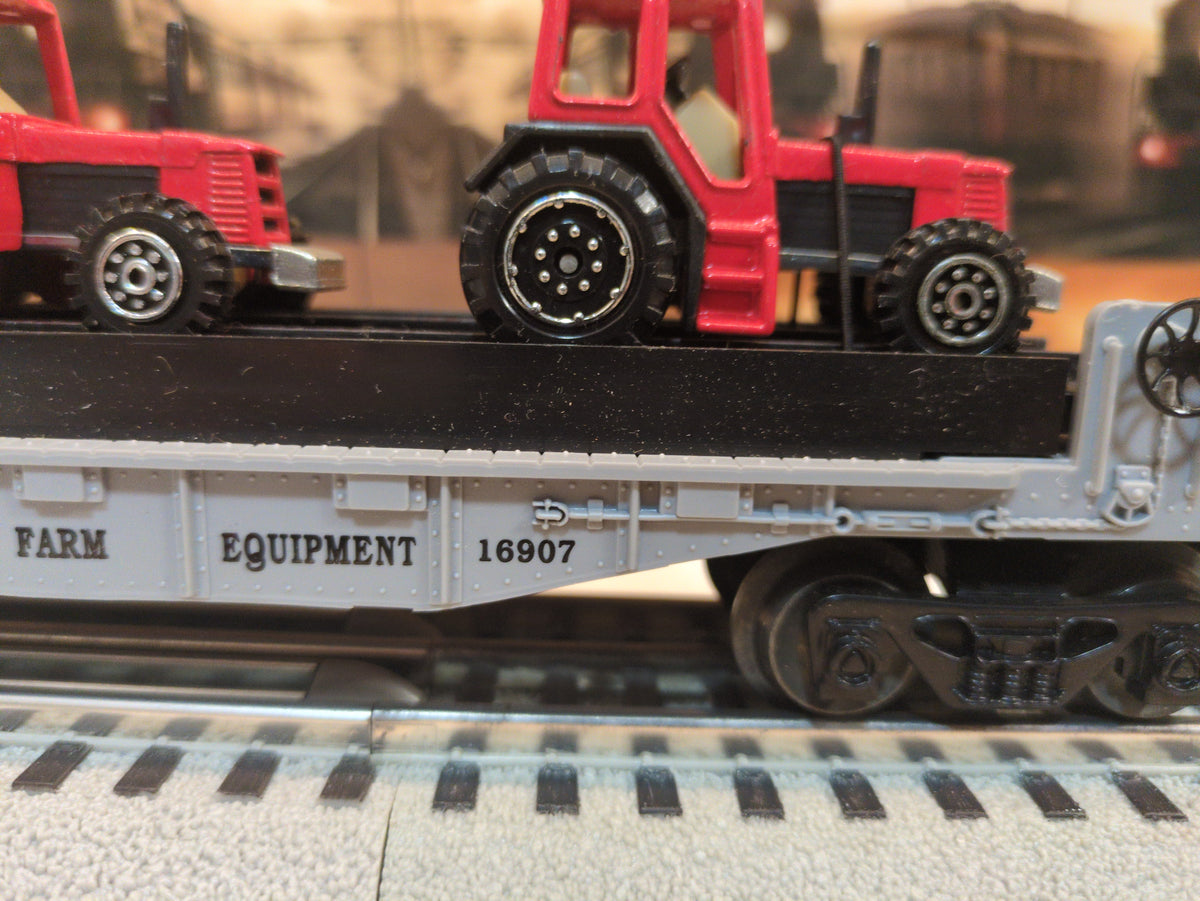 Lionel flat car with farm tractors 6-16907